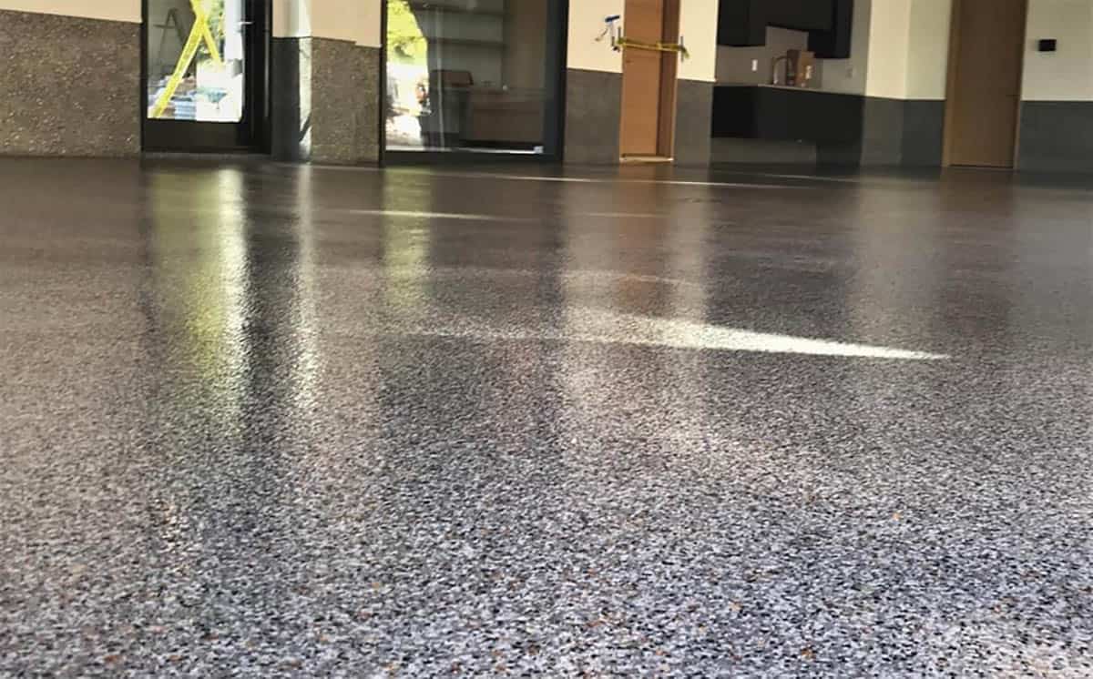 Beautiful high-gloss epoxy and polyaspartic full-flake flooring on an outdoor space.
