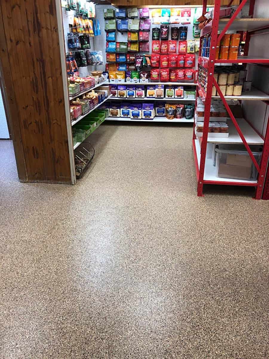 Storage room with high gloss mica-infused full flake epoxy flooring.